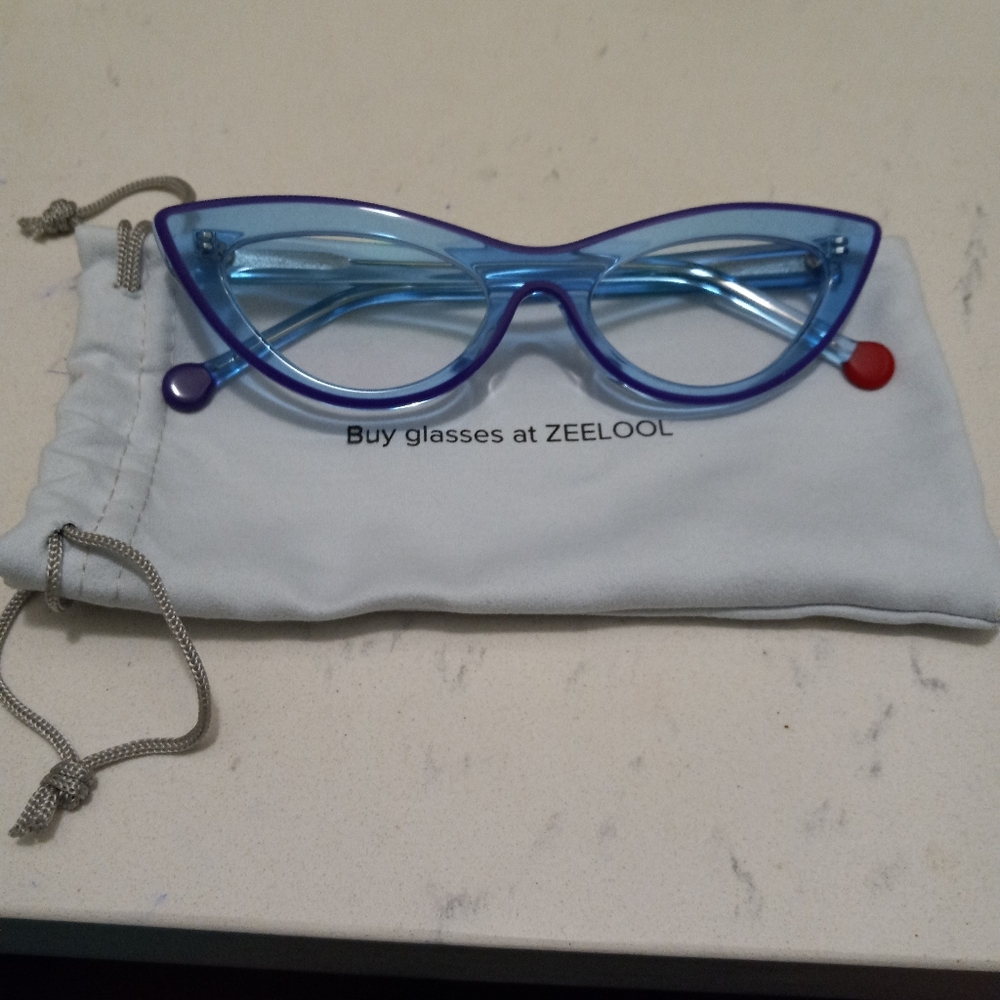 Blue cat eyed eye glasses. Can be changed to prescription eye glasses.